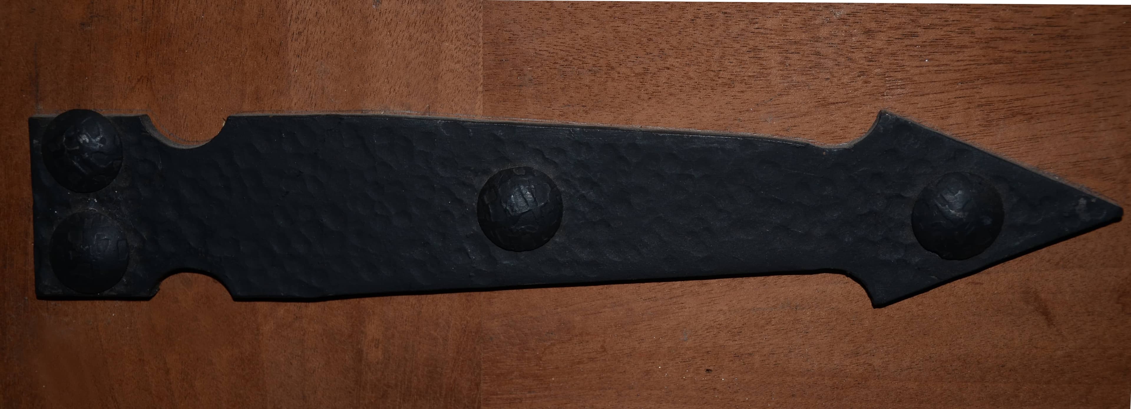 Wrought iron decorative hinge strap on mahogany